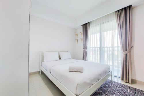 Pondok Aren Apartment | Cozy 1BR Apartment at Bintaro Embarcadero by Travelio