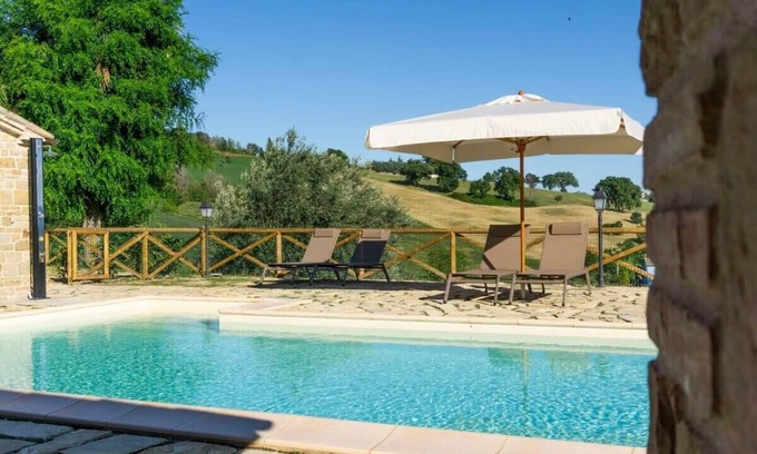 San Severino Marche Villa | Inviting Poolside Villa with Relaxing Sunbathing Area