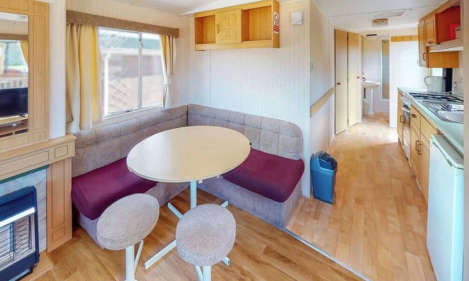 Llanllwchaiarn House | Inviting Caravan with Pool and Oceanfront Views