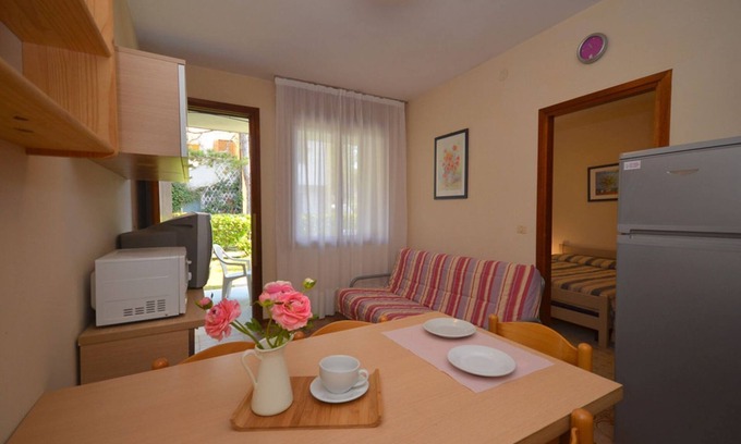 Bibione Apartment | Comfortable two room apartment with garden and swimming pool by Beahost Rentals