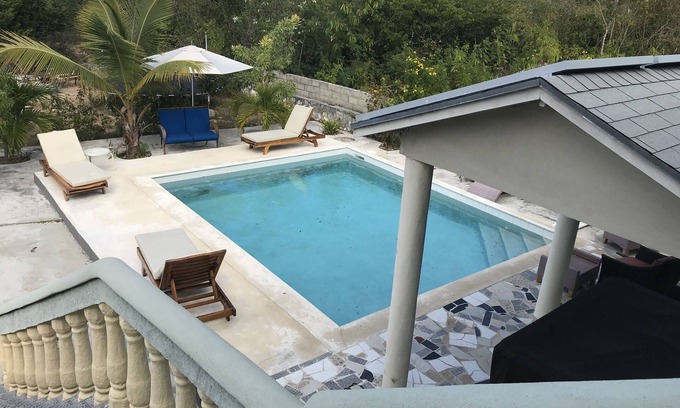 Discovery Bay Apartment | Cozy 15E Apartment in Sagusta Gardens with Pool View