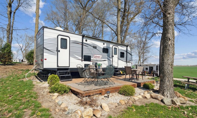 Langworthy RV Rental | Cozy Coleman Camper with Lake View & Breakfast in Delhi, IA