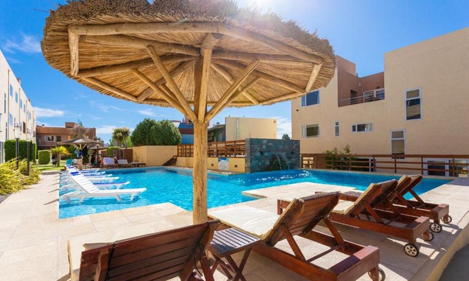 Las Grutas Apartment | Discover Complejo Tamariscos: Family-Friendly with Pool