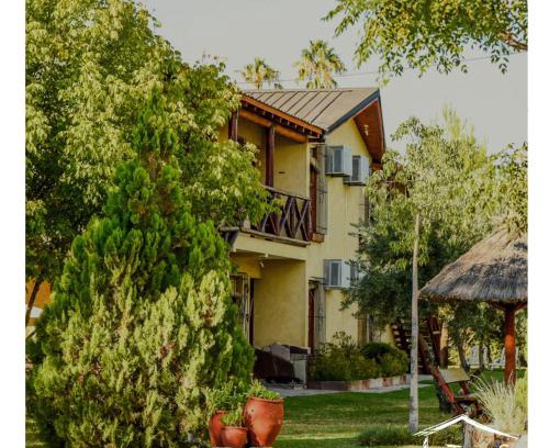 San Rafael Cabin | Discover Complejo Turistico Los Troncos: Poolside Relaxation