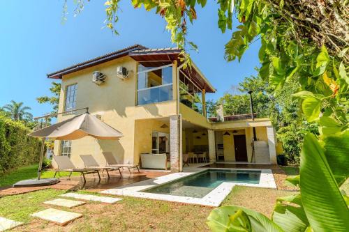 Costa do Sol House | Guaratuba Retreat: Poolside Haven Near the Ocean