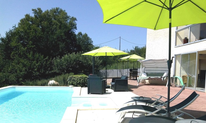 Pujols Apartment | Modern Poolside Retreat with Private Garden & Breakfast