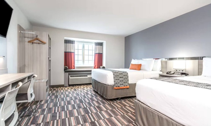 Rochester House | Cozy Stay at Coratel Inn & Suites with Pool and Breakfast