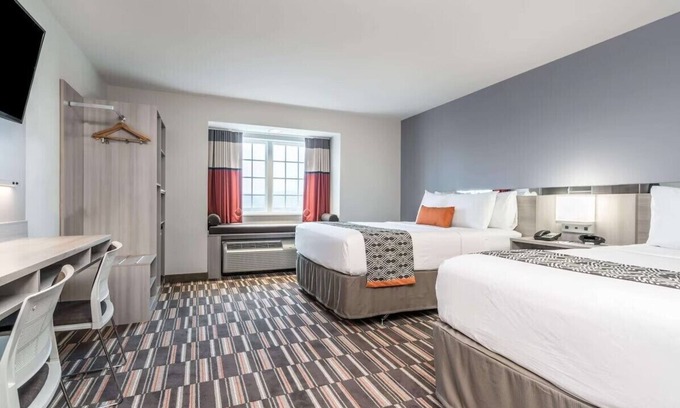 Rochester House | Comfortable Coratel Inn & Suites with Pool and Breakfast