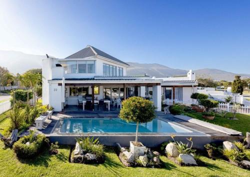 Onrus House | Corner Delight: Ocean View Retreat with Full Backup Power