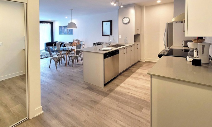 Brossard Apartment | Corporate Stays - 5mins from Walmart Modern 1BR at Blum with Premium Amenities