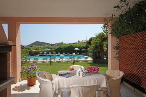 Manerba del Garda Apartment | Elegant Corte degli Olivi Appartamenti with Ocean Views