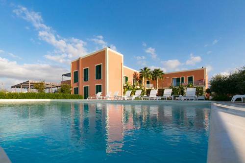 Paceco Resort | Discover Corte Olea Resort: Oceanfront Haven with Pool