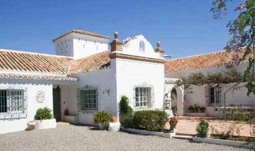 Urbanizacion Hacienda las Chapas House | Relax at Cortijo Correa: Oceanfront Bliss with Spa Access