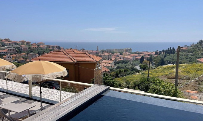 San Lorenzo al Mare Apartment | Cozy Apartment with Pool and Ocean Views for 4 Guests