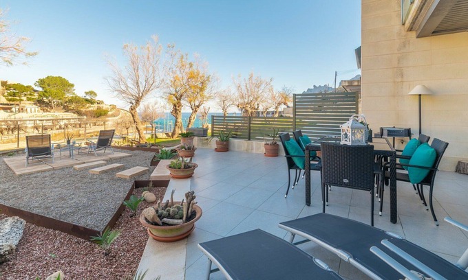 Cala Carbo Apartment | Inviting Oceanfront Apartment for 4 with Free WiFi & A/C