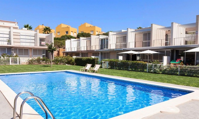 L'Ampolla House | Cosy apartment in villa for 6 people with WIFI, A/C, pool, TV, patio, pets allowed and parking