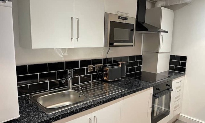 Stonnall Apartment | Modern 1-Bed Apartment with Kitchen Amenities Await You