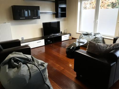 Lommel Apartment | Inviting Cosy Corner with Hot Tub & Family-Friendly Vibes