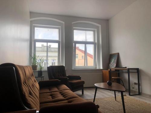 Silute Apartment | Inviting Getaway in a Historic Building with Family Amenities