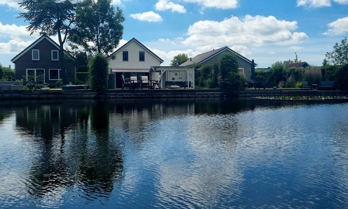 Onderdijk House | Cottage on the water in Holland with private dock - fishing vacation & more
