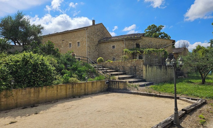Saint-Paulet-de-Caisson Apartment | Country gîte in a stone farmhouse, in the countryside with shared swimming pool
