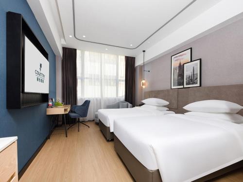 Shajing Hotel | Explore Country Inn & Suites near Shenzhen Convention Center