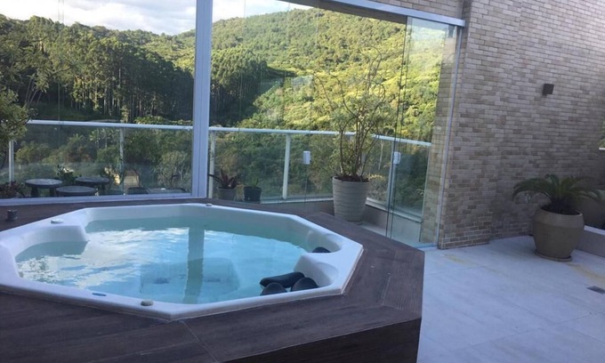 Florianopolis Apartment | Relaxation Awaits: Coverage with Hydro Spa and Pool Access