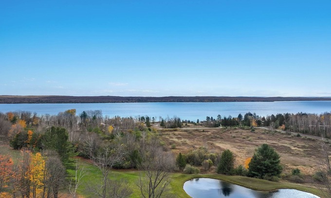 Kewadin Condo | Cozy 3-bedroom condo overing looking Torch Lake on the A-Ga-Ming Golf Course