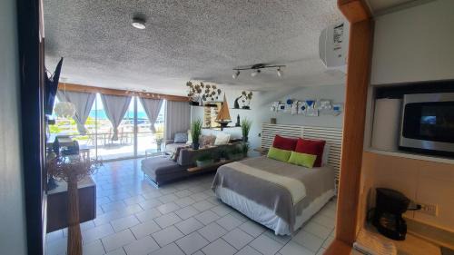 Cabezas Apartment | Inviting Ocean Front Apartment with Pool & Pet-Friendly Perks