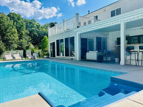 Indian Trail House | Charming Bedroom Suites with Pool Access and Ocean Views