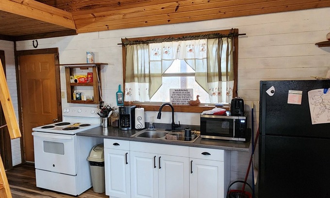 Pineville Cabin | Inviting Cabin by Huckleberry Conservation with Firepit