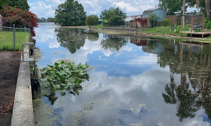 Orange Lake Village House | Waterfront Canal Cottage with Spa and Ocean Views