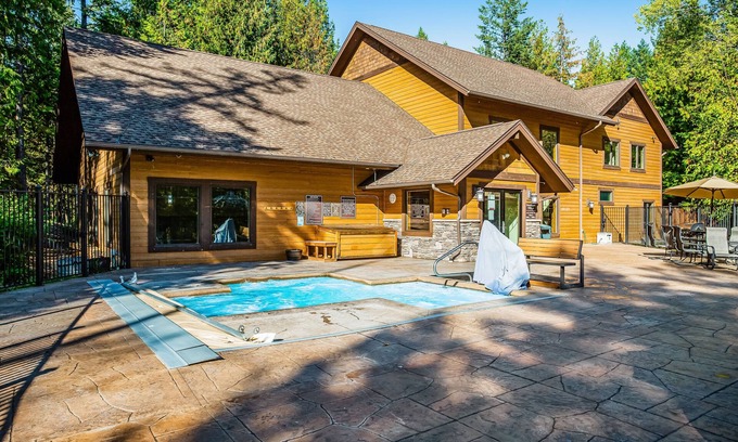 Whitefish Condo | Cozy condo with deck, wood stove, pool, sauna, tennis - near skiing & fishing