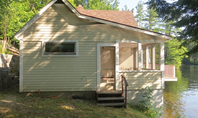 Weare Cottage | Charming Lakefront Cottage with Pool and Hot Tub