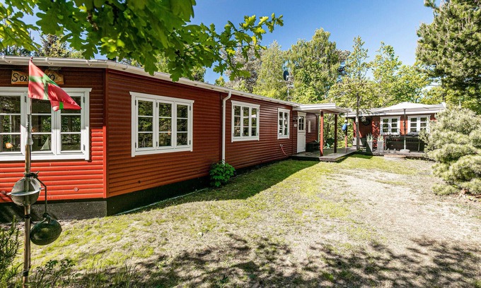 Bedegaard House | Cozy Family Getaway: Embrace Nature in a Red Wooden House