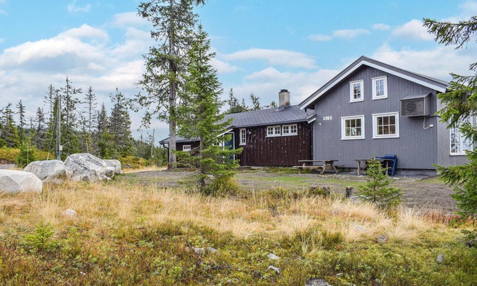 Sjusjoen House | Experience Nature in a Cozy Wooden Cottage Retreat