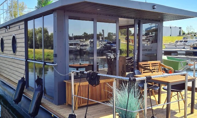 Ophoven Boat Rental | Modern Houseboat with Cozy Terrace and Lake View Amenities