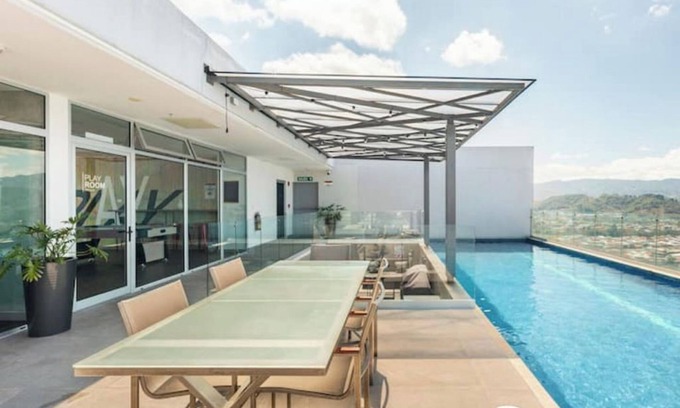 San Pedro Apartment | Inviting Space with Rooftop Pool, Gym & Family-Friendly Perks