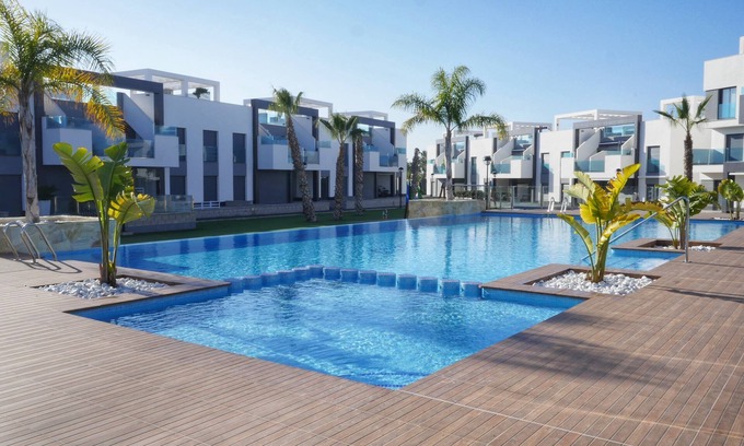 Guardamar del Segura Apartment | Inviting Oasis Beach Apartment with Pool and Ocean Views