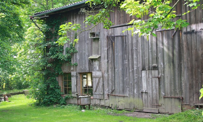 Kirch Mulsow House | Rustic Barn Retreat with Dining Area Under the Trees