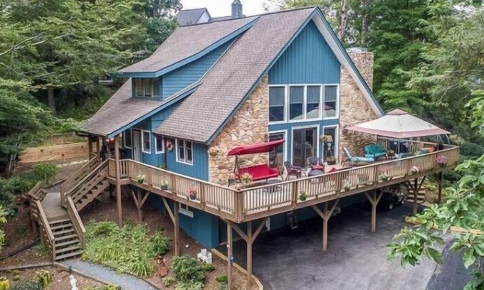 Newland House | Inviting Creekside Cabin with Hot Tub & Lake Views