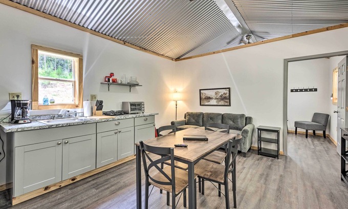 East Tallassee Cabin | Pet-Friendly Creekside Cabin Retreat with Fire Pit & Spa