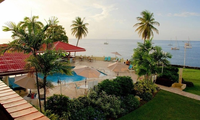 Bon Accord Village Hotel | Beachfront Bliss at Crown Point Beach Hotel with Pool