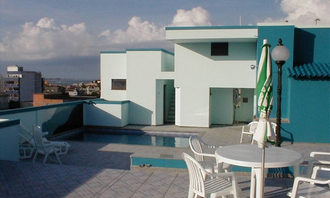 Macae Apartment | Enjoy Ocean Views at Crystal Apart Hotel with Pool Access