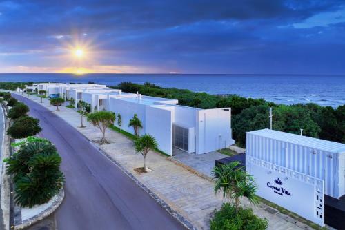 Ueno Villa | Elegant Crystal Villa Bayside: Oceanfront Retreat Awaits
