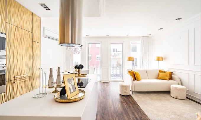 Santa Engracia Apartment | Stylish Curcumin Gold Apartment with Kitchen & AC Amenities