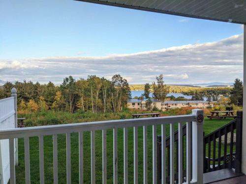 Weirs Beach Apartment | Inviting Cedar Lodge Room with Balcony & Scenic Lake Views