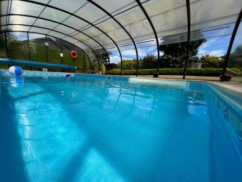 New Forest District House | Relaxing Cypress Log Cabins with Oceanfront Pool Access