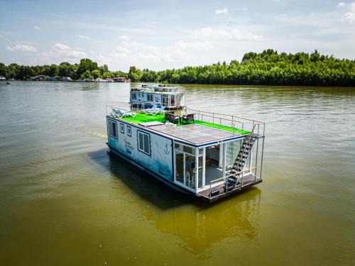Murighiol Boat Rental | Experience Danubiu House Boat: Private Beach & Ocean Views