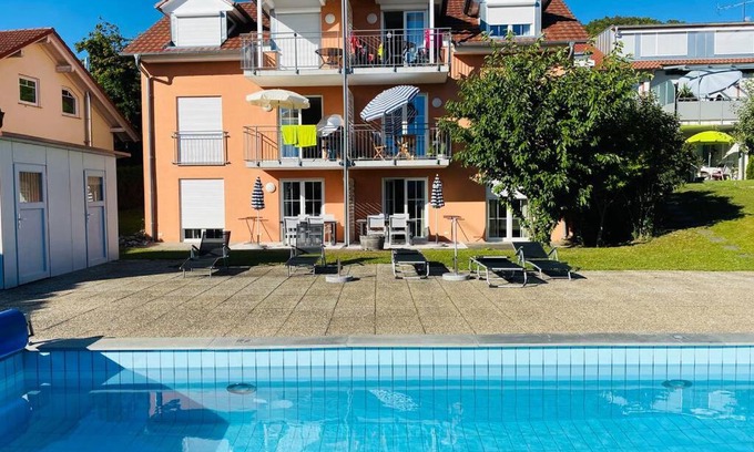 Ludwigshafen Apartment | Inviting Das Schneckenhaus: Poolside Retreat with Sea Views
